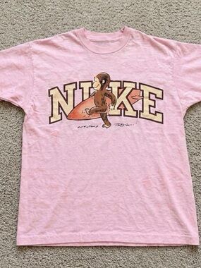 Gildan Light Pink Curious George Surfboard Graphic T-shirt